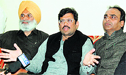 State president of the Bharatiya Janata Party (BJP) Kamal Sharma (centre) adresses mediapersons in Amritsar on Thursday