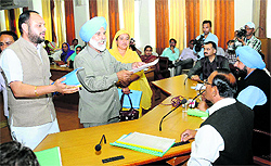 Congress councillors make their point before Mayor Baljit Singh Bir Behman (in turban) during the meeting of the Municipal Corporation