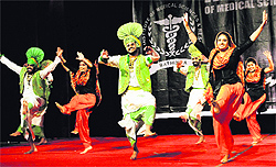 Students perform bhangra at the cultural festival held at Adesh University on Thursday