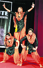 Girls perform the gidha dance at the festival