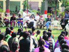 Children demonstrate karate skills to girls at Manohar Memorial College, Fatehabad. 