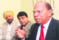 Former Congress minister Chaudhary Jagjit Singh along with party leaders addresses the media in Jalandhar on Thursday. Tribune photo: Malkiat Singh