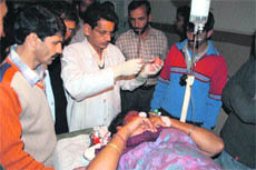 One of the injured being treated at the district hospital in Rajouri on Thursday. 