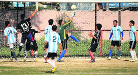 Players in action during the Rajiv Gandhi Gold Cup Football Tournament in Jammu on Thursday. 