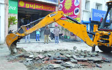 A demolition drive under way in Ludhiana. 