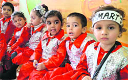 Children wait for their performance during the annual concert at Cherrylane Playschool in Ludhiana.