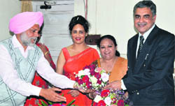 The staff members welcome Prof Rajinder Singh, the new principal of the SCD Government College, in Ludhiana on Thursday. 