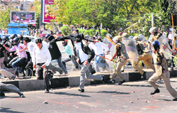 Policemen lathicharge lawyers during a protest at District Courts in Jaipur on Thursday.  PTI