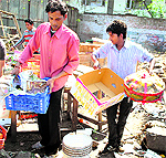 Traders collect their belongings after a demolition drive in Patiala on Thursday