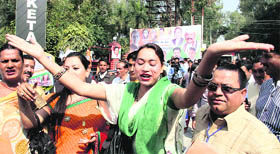 Eunuchs dance outside the venue where Rahul Gandhi was meeting party workers in Dehradun on Friday.
