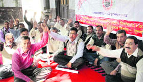 Members of the Lekhpal Sangh hold a dharna in support of their demands in Dehradun.