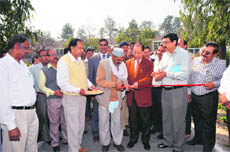 Dunger Singh Bisht, a farmer, cuts a ribbon to inaugurate the 93rd Kisan Mela at Pantnagar Agriculture University on Friday. 