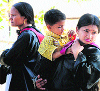 Students wait outside the venue for the first convocation at Bhagat Phool Singh University at Khanpur Kalan (Sonepat) on Friday