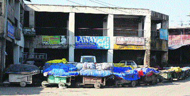 Handcarts of fruit-sellers wrapped in plastic sheets during the curfew in Srinagar on Friday. 