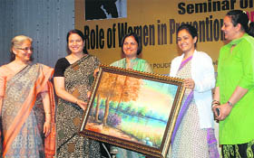 Principal of the Apeejay College of Fine Arts Dr Sucharita honours IG (Zonal) Gurpreet Deo and Deputy Commissioner Shruti Singh during a Womens Day function organised by the Punjab Police