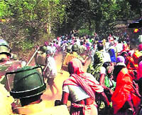 Police charge villagers during a protest against land acquisition at the proposed Posco site in Jagatsinghpur district on Thursday. 