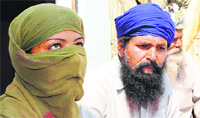 Tarn Taran police assault victim and her father at Usma village on Friday. Photo: Vishal Kumar