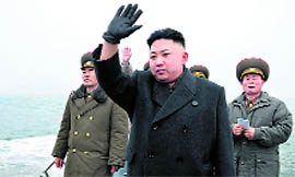 North Korean leader Kim Jong-Un (C) at the Jangjae Islet Defence Detachment near the border with South Korea on Thursday.
