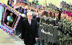 Newly elected Czech President Milos Zeman walks past a guard of honour after the inauguration ceremony at Prague Castle on Friday.