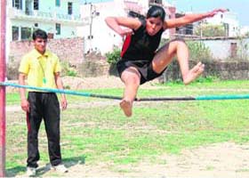 Aarti Don participates in a high-jump event during the three-day sports meet at Shravan Nath Jawaharlal Nehru College in Haridwar on Saturday