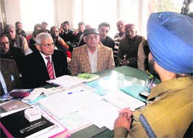Senior citizens meet a police official to express concern over an increase in crime in Mussoorie on Saturday