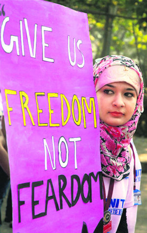 A college student takes part in a rally to mark International Women's Day in Kolkata on Friday.