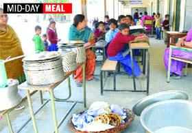Children wait for mid-day meal at a school in Ludhiana.