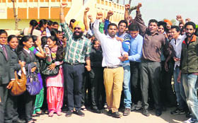 Students raise slogans against the college administration at the Ludhiana Group of Colleges, Chaunkiman, near Jagraon on Saturday.