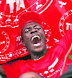 A supporter of Uhuru Kenyatta celebrates on the outskirts of Nairobi on Saturday.