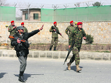 Soldiers keep watch near the site of an attack in Kabul on Saturday.