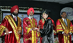 Vice-chancellor of the Central University of Punjab Dr Jai Rup Singh (centre) awards degree to a dental graduate in Ferozepur on Sunday