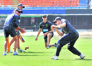 Members of the Australian cricket team during a practice session at PCA Stadium in Mohali.