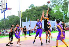 Players in action during the ongoing All-India Invitational Basketball Tournament for Men at Sports Complex, Sector 46, in Chandigarh. 