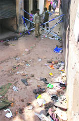 Slippers of devotees in a narrow lane leading to the Shiv temple.
