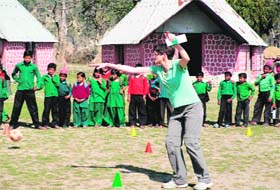 Muriel, a voluntary teacher from Ireland, plays games with Van Gujjar children at RLEK school in Saharanpur district on Sunday