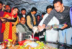 People pay obeisance at the Tapkeshwar temple on the occasion of Mahashivratri in Dehradun on Sunday