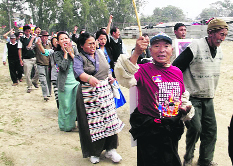 Tibetans take out a march on National Uprising Day in Dehradun on Sunday.