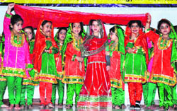 Students perform during annual day celebrations of Dream Care Playway school in Jammu on Sunday. 