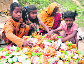 Serving the faith These little hands are ready to sell idols of Hindu deities on Shivratri in Jammu on Sunday. 