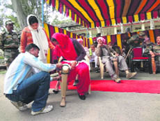 A patient being provided with an artificial limb at a camp in Rajouri on Sunday. 