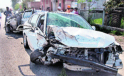 The mangled remains of the cars on the Jalandhar-Pathankot highway