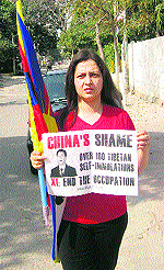 Trishma Vasudev, Jalandhar project coordinator of the Students for a Free Tibet, holds a march in Model Town locality in Jalandhar on Sunday