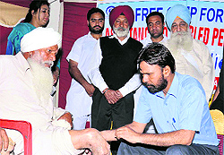An artificial limb distribution camp in progress at Malri village in Nakodar near Jalandhar on Sunday