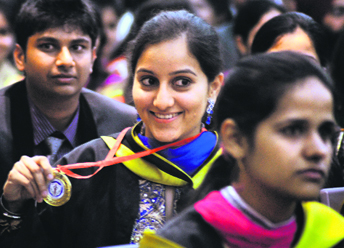 Satjeet Kaur Deol, best graduate of the MBBS 2007 batch, shows her gold medal during the annual convocation at the DMCH in Ludhiana.