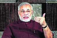 Gujarat CM Narendra Modi addresses NRIs through videoconferencing in Gandhinagar on Sunday