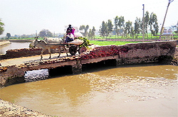 The damaged bridge near Abohar from where the minors slipped into the Malukpura sub-canal on Sunday