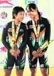 Deborah and Manorama Devi on podium.