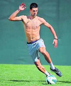 Novak Djokovic relaxed in the California sun by showing off his football skills... with Victoria Azarenka's boyfriend, LMFAO singer Redfoo.