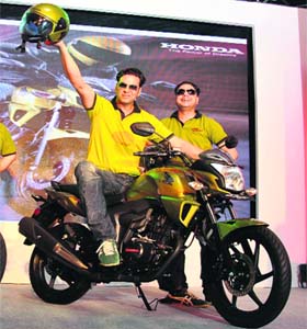 Honda India CEO Keita Muramatsu (R) with the companys brand ambassador, Bollywood actor Akshay Kumar, at the launch of the Honda CB Trigger 150cc bike in Gurgaon on Monday