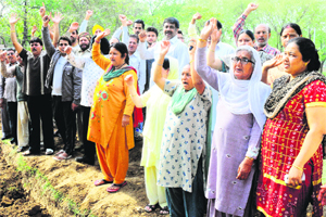 Residents oppose the construction of a Sahaj Safai Kendra in a green belt at Sector 45, Chandigarh, on Monday. 